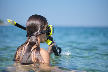 Aqua woman diver spearfishing gun.