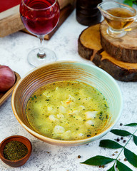 аzeri traditional dyushbara with dried mint and a glass of juice