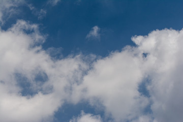 Clear blue sky and white clouds summer background
