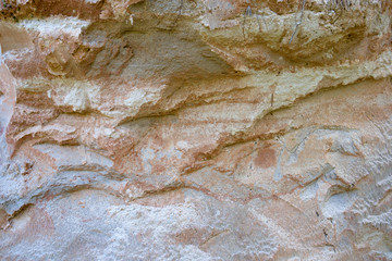 Cross section of sandy soil, relief vertical cut closeup, textured background image