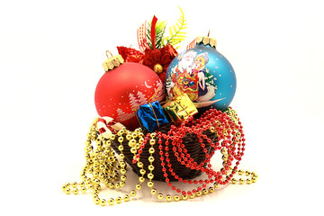 Photo of decorations for Christmas and New Year, a composition of decorations for the Christmas tree, holiday Christmas balls, isolated on white background