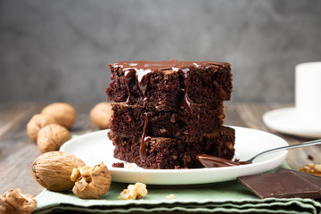 Chocolate brownies with walnuts and melted chocolate