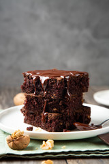Stack of brownies with melted chocolate