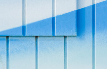 Surface of a blue wooden background with two surfaces