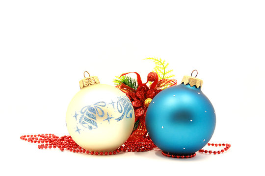 Photo of decorations for Christmas and New Year, a composition of decorations for the Christmas tree, holiday Christmas balls, isolated on white background