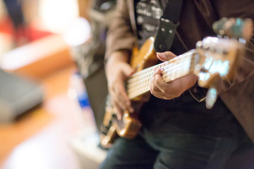 guitarist plays. chord on an electric guitar. Close up of an electric guitar being played.