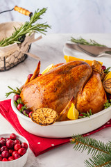 Christmas chicken in a white ceramic form on a light background. Christmas atmosphere.