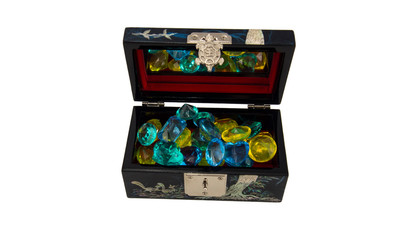 Jewelry box with gems on white background