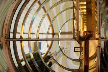Lighthouse lens with brass structure and filaments lamp. Boanova lighthouse, Porto, Portugal.