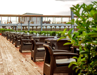 outdoor restaurant with wicker chairs