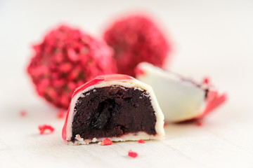Chocolate truffels with a red fruit glaze