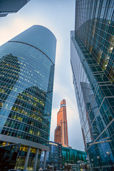 Tops of modern corporate buildings against the gloomy sky. high-rise buildings and skyscrapers Moscow International Business Center (Moscow City), Russia. City view from the bottom up © Oleksii Hlembotskyi