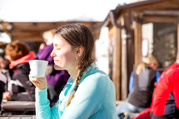 Happy people, children and adults, skiing on a sunny day in Tyrol mountains