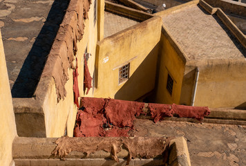 Chouara tannery in old medina in Fes, a traditional and old tannery with workers working making methods of leather in the city Fes, Morocco