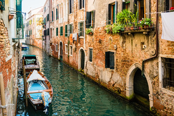 Fototapeta na wymiar Traditional canal street in Venice, Italy