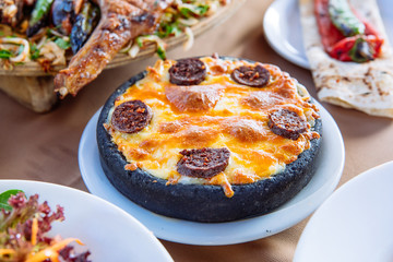 Traditional Turkish Hummus food appetizer on table from top view in turkish restaurant.	