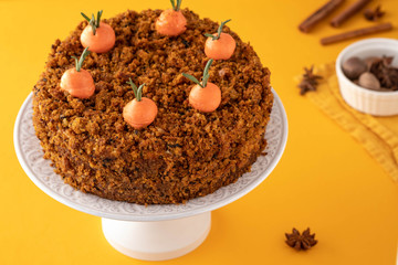 Traditional homemade carrot cake and cream carrots. Copy space.