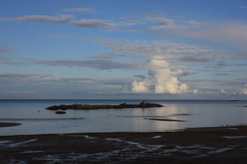 Summer scene in Vita Sannar, Sweden. Cumulus cloud over Lake Vanern.