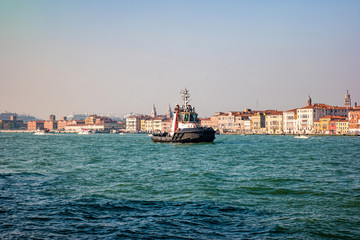 Fototapeta premium Powerful tugboat for cruise liners sailing in Venetian Lagoon