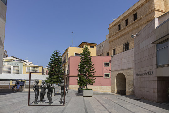 Elche, Spain - July 4, 2019: Sculptural ensemble 'Sobre la critica' in front of town hall in Elche.