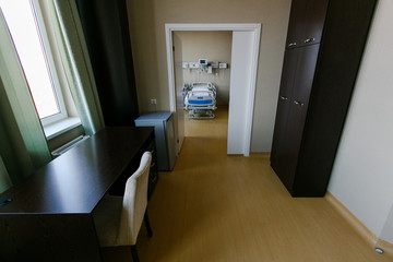 New medical center. Clean and empty room with a new bed in the new medical center.