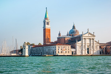 Fototapeta na wymiar Bell tower and church of Saint George also called San Giorgio Maggiore in Venice, Italy