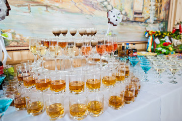 Dessert table of cocktails beverages on wedding reception.