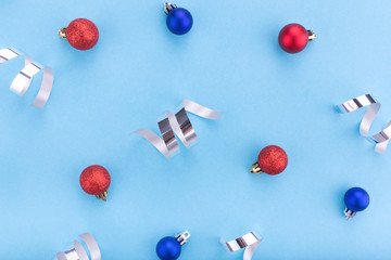 New year and Christmas concept. Christmas balls on blue background. Flat lay, copy space, top view. Christmas composition.