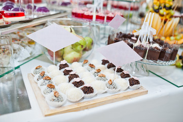 Obraz na płótnie Canvas Dessert table of delicious sweets on wedding reception.