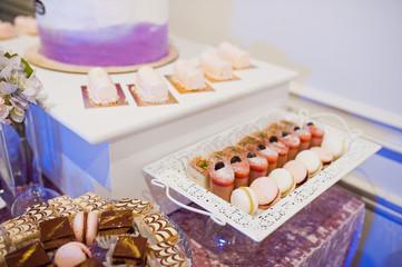 Dessert table of delicious sweets on wedding reception.