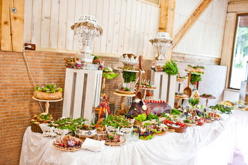 Dessert table of delicious snacks on wedding reception.