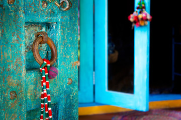 Close up blue door, Bhutan style door entrance.