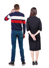 Back view of couple. beautiful friendly girl and guy together.