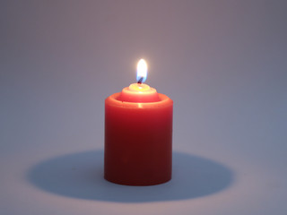 Red candle isolated on white background