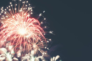 Brightly colorful fireworks in the evening sky background
