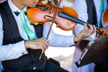 A man playing  a violin .in soft and blur style for background.