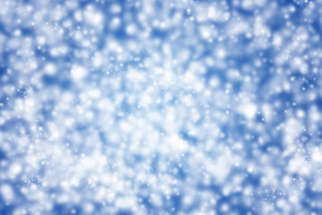 Fondo azul navideño con copos de nieve.