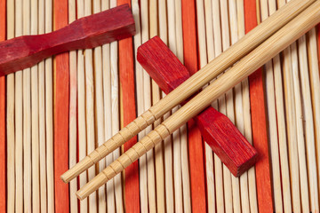 Sushi wood bamboo sticks with red mat