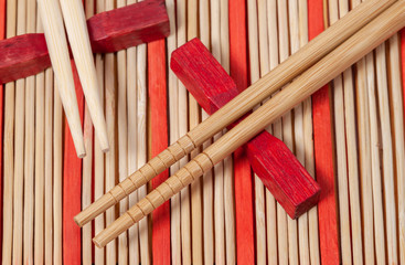 Sushi wood sticks with bamboo striped mat