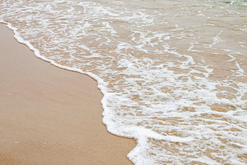 Soft waves of clear sea water on beautiful beaches.