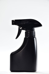 Black spray bottle. Putting on a white background
