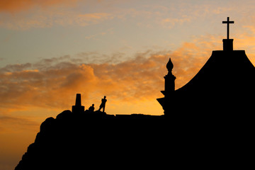 Chapel with people silhouette at sunset. Contre-jour. Leça da Palmeira, Porto, Portugal.