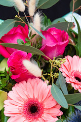 Beautiful fresh flowers in a bouquet close-up, orchids, gerberas, roses. Concept of nature.