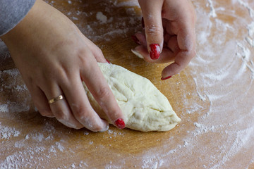 The process of making buns with tea. Raw dough for baking in the oven.