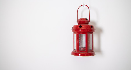 Obraz premium decorative small red lamp decoration element hanging on white wall simple background pattern copy space for your text here 