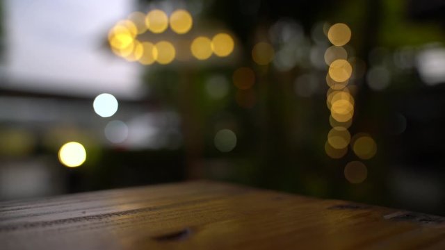 Outdoor Asian style garden with light decoration and wooden furniture