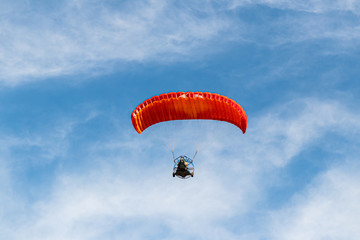 Athletes on  a motorized parachute fly at low altitude above the Mediterranean coast near Caesarea in northern Israel