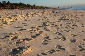 Many Footprints in Beach Sand by Ocean in Mexico