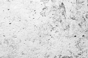 Texture of a concrete wall with cracks and scratches which can be used as a background