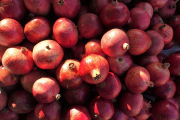 closeup of pomegranates on display at the market